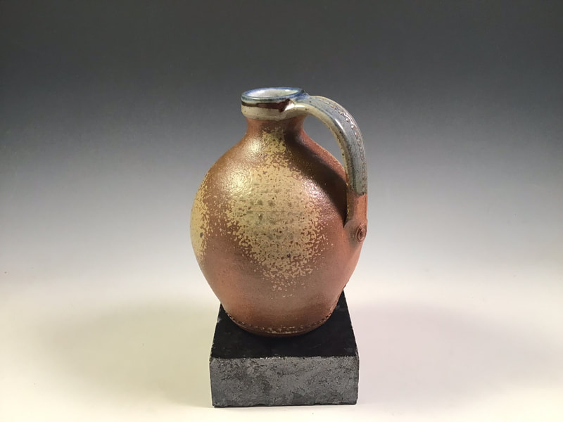 Strap bottle, wood ash spray, impressed handle, cone 10 in propane reduction. Signed.
$78 includes shipping to L48.
Contact Simon at: simonleachpottery@gmail.com