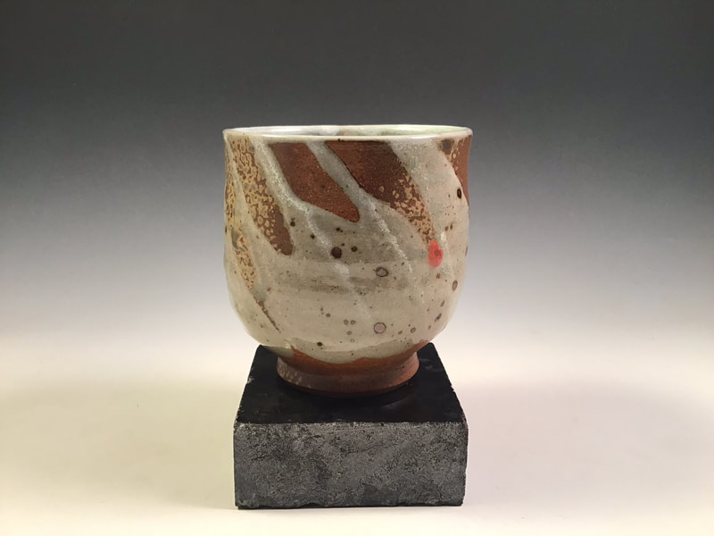 Tea bowl with trailed glaze decoration and wood ash spray, signed, cone 10 in propane reduction. Signed. $75 includes shipping to L48.
Contact Simon at: simonleachpottery@gmail.com