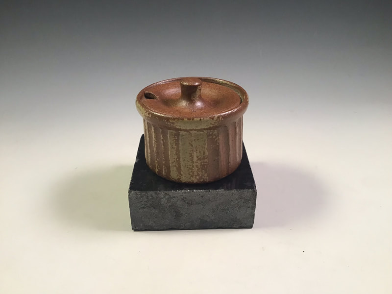 Small fluted mustard pot, wood ash sprayed. Signed. $49 includes shipping to L48. Contact Simon at: simonleachpottery@gmail.com